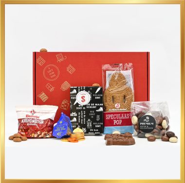 Sinterklaas pakket met een melkchocolade letter S UTZ, Bolletje kruidnoten, gemengde chocoladekruidnoten, chocolade munten, Sint schuimpjes en een banket speculaaspop, ideaal voor het vieren van Sinterklaas.